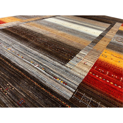 Close-up of a Gabbeh-Luri rug: woven lines and color accents in brown, gray, and orange