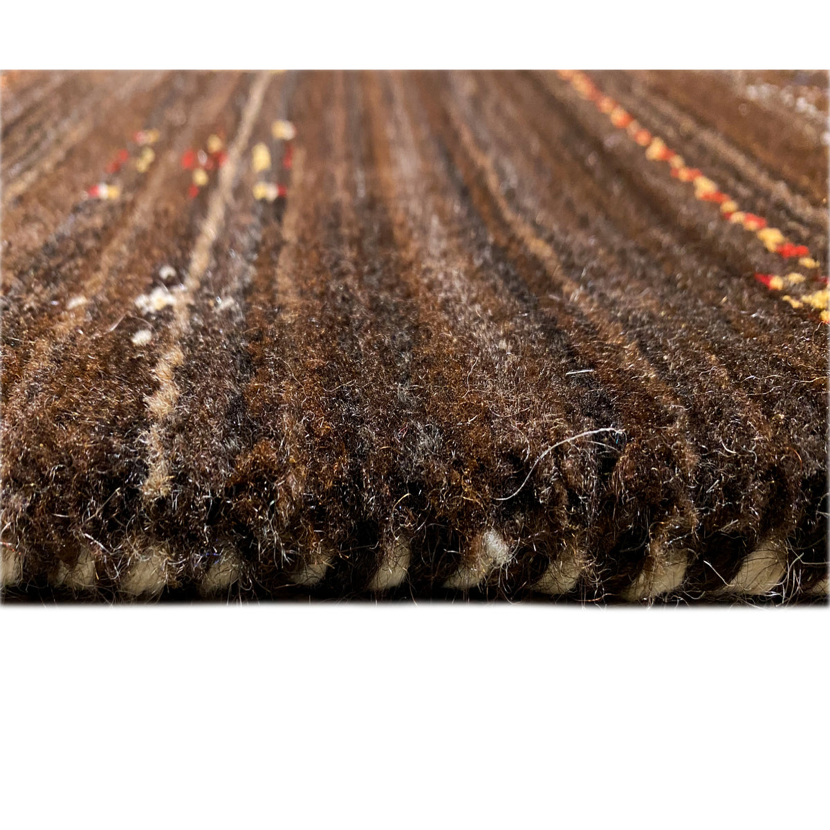 Gabbeh-Luri rug, close-up of the pile surface, brown with fine light-colored yarn traces