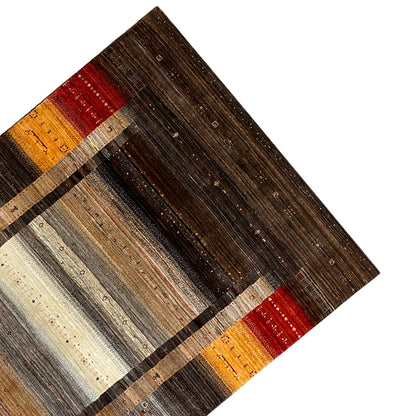 Gabbeh-Luri rug detail with border stripes in beige, orange, and red on dark brown