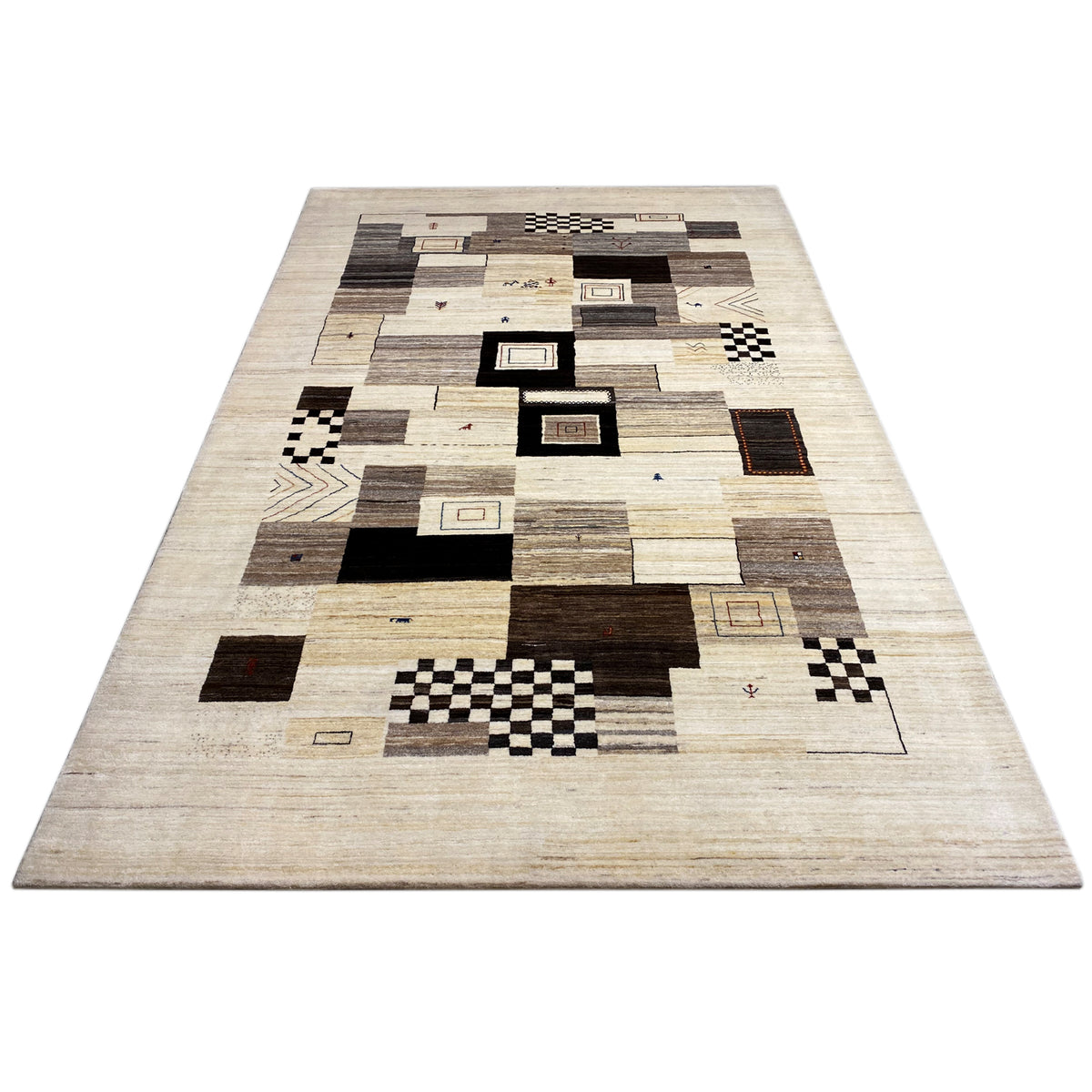 Beige rug with patchwork patterns and black/brown squares, wide-ranging