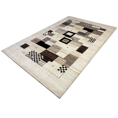 Rug with a beige background and dark rectangles, squares, and stripes in a patchwork design