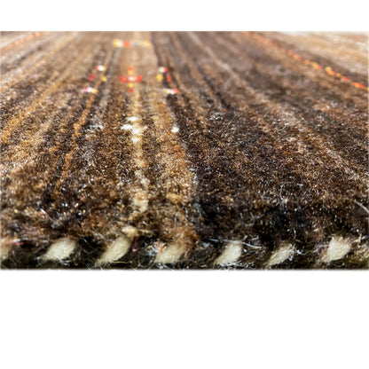 Carpet pile in close-up: brown-gray fibers with light areas along the edge