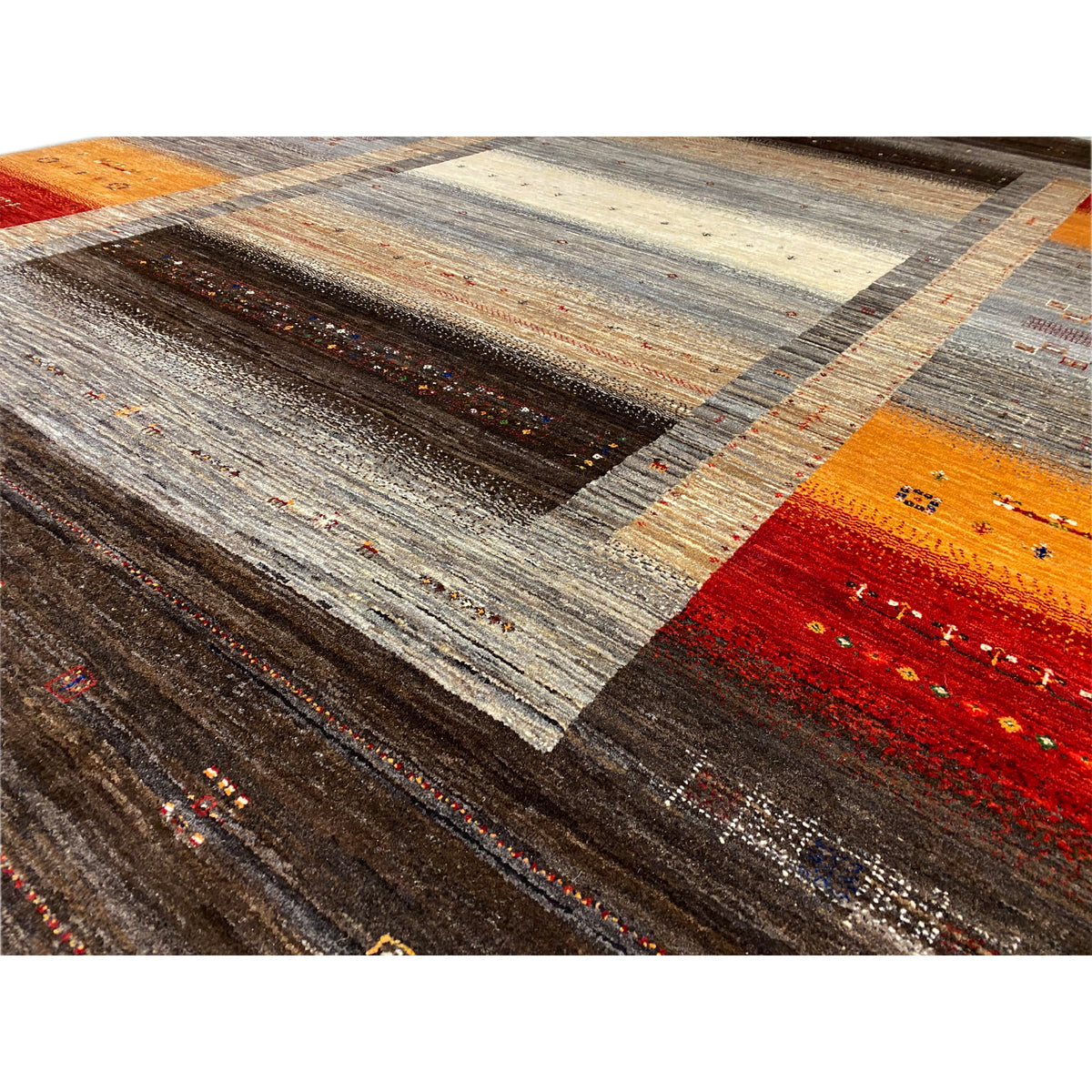 Gabbeh-Luri rug detail: woven lines and contrasting areas in gray, brown, orange, and red