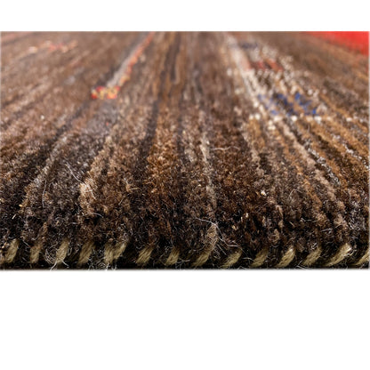 Gabbeh-Luri rug close-up of the pile structure in dark brown and gray