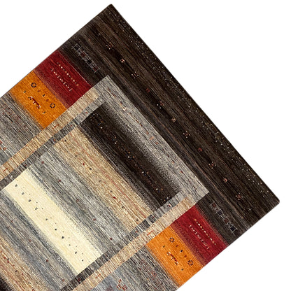 Gabbeh-Luri rug corner with border, dark brown, gray, and red/orange accents