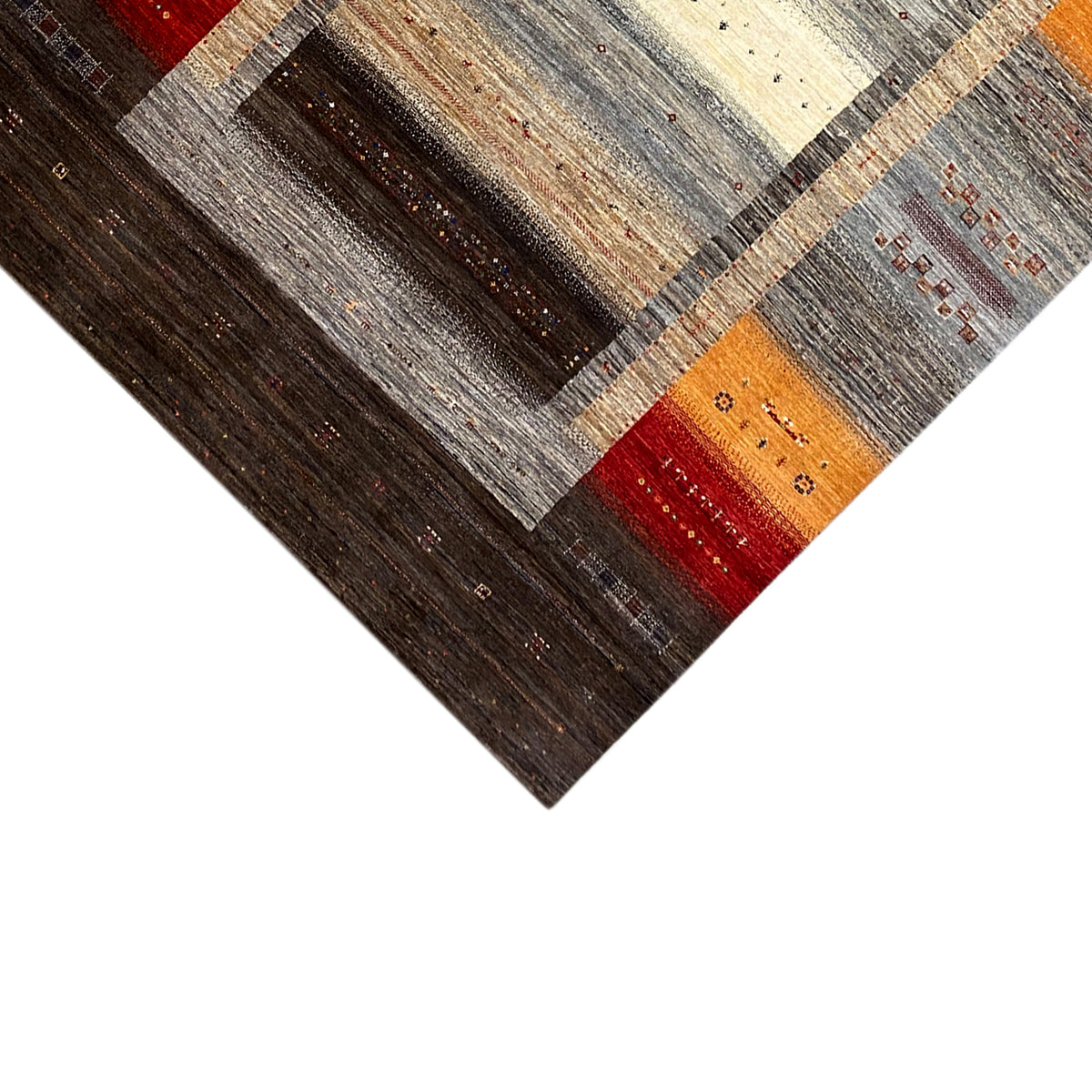 Gabbeh-Luri rug detail at the edge with grid lines in brown, gray, orange, and red