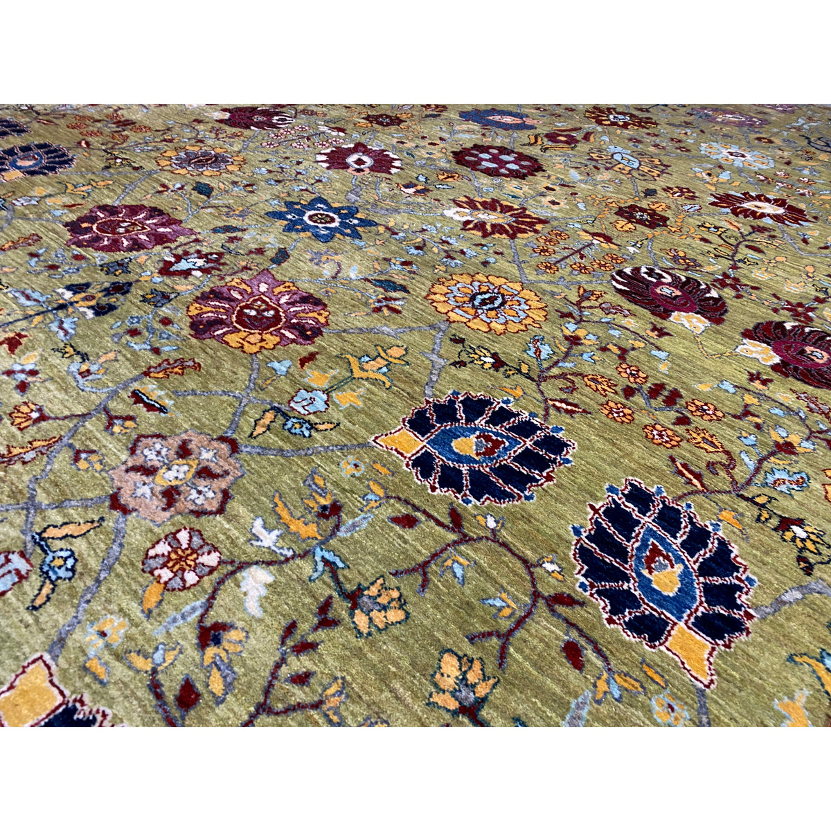 Detailed view: Oriental rug pattern with floral and vine ornaments in blue and red