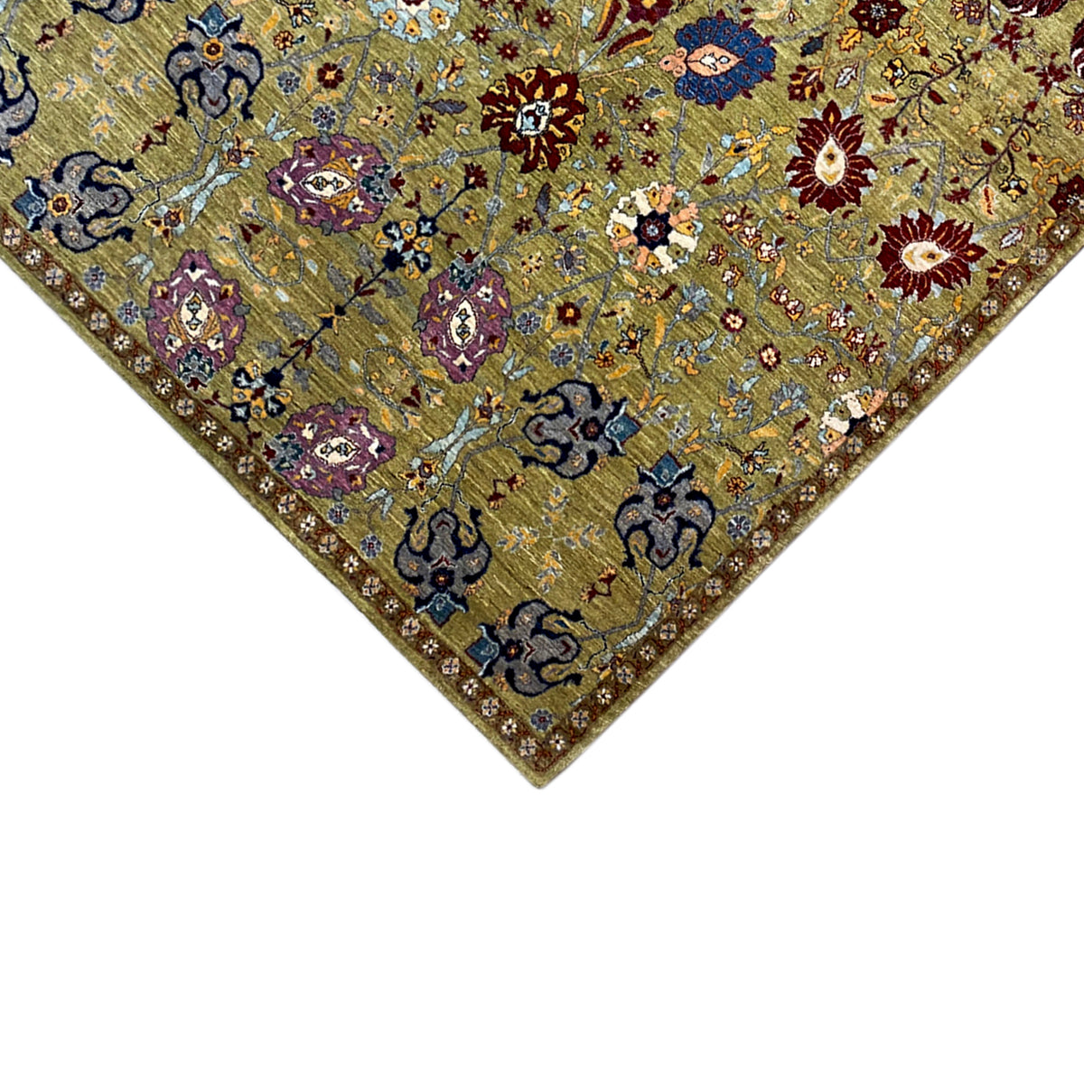 Close-up of a carpet corner with a border, a mix of olive, blue, and red hues
