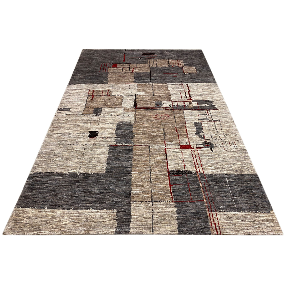 Abstract low-pile rug with patchwork in gray/beige and red accents, viewed from above