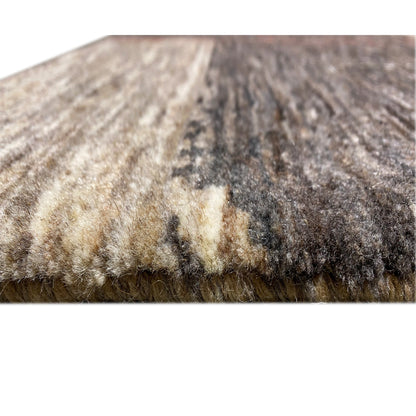 Detail of the carpet surface: marled yarns in gray, beige, and dark sections