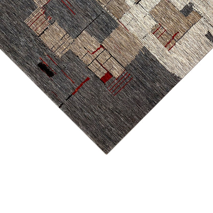 Carpet corner in detail with gray and black stripes and red cross-lines