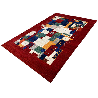 Gabbeh Luri rug in a patchwork look: red background with colorful geometric fields