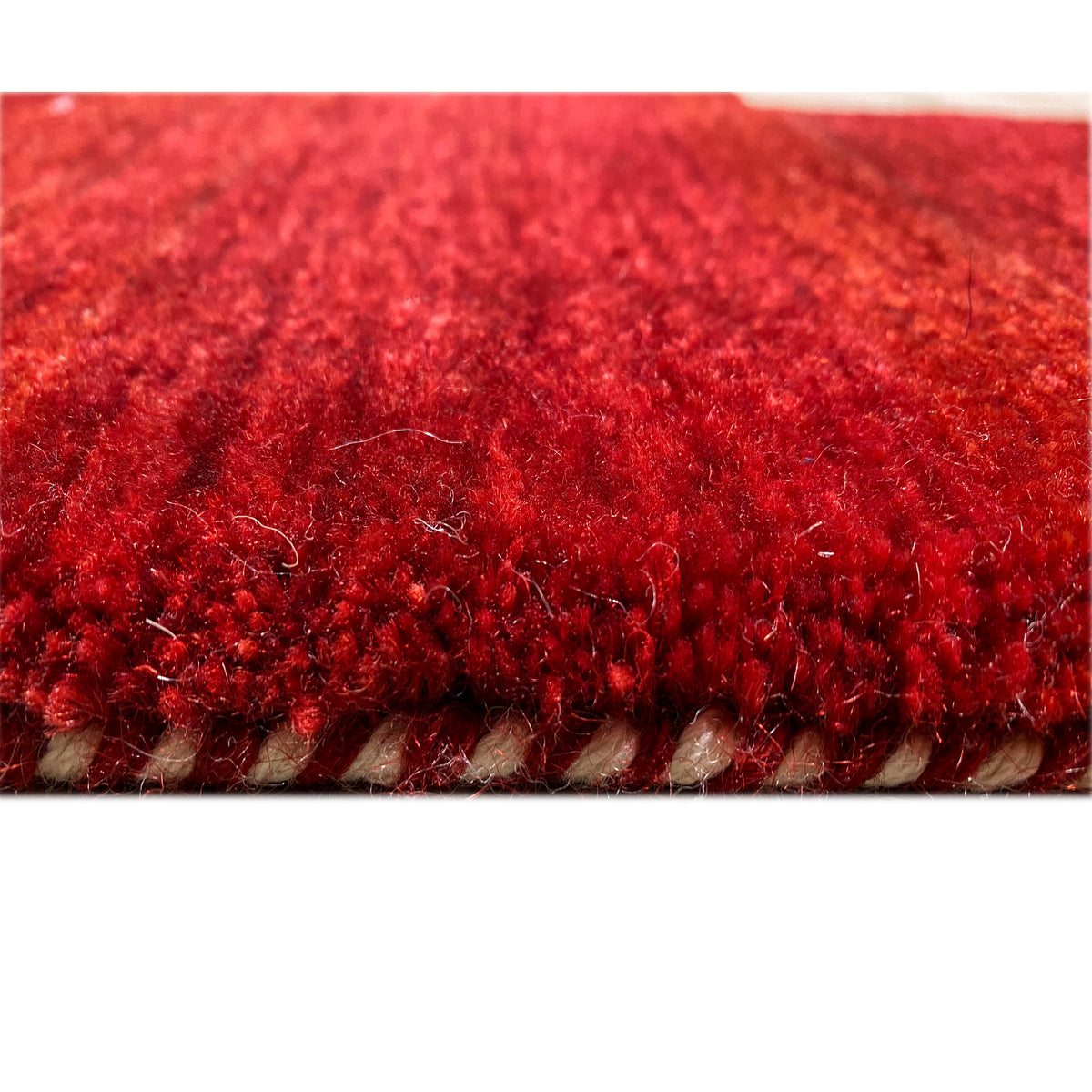 Gabbeh Luri rug - close-up of the pile surface in vivid red
