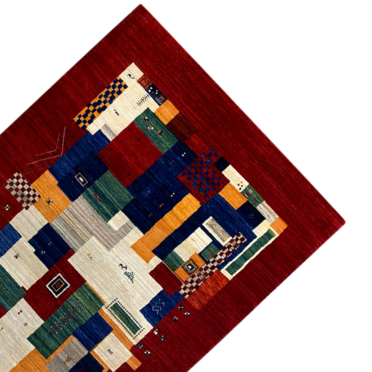 Gabbeh Luri rug detail: red border with patchwork fields in blue and beige