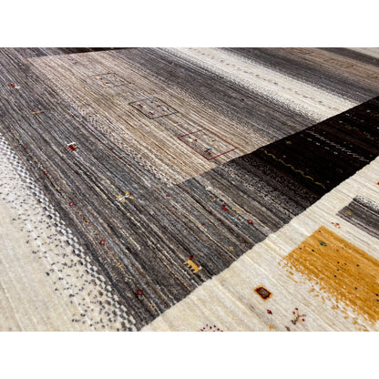 Gabbeh-Luri rug close-up: textured pile, graphic fields in gray and beige