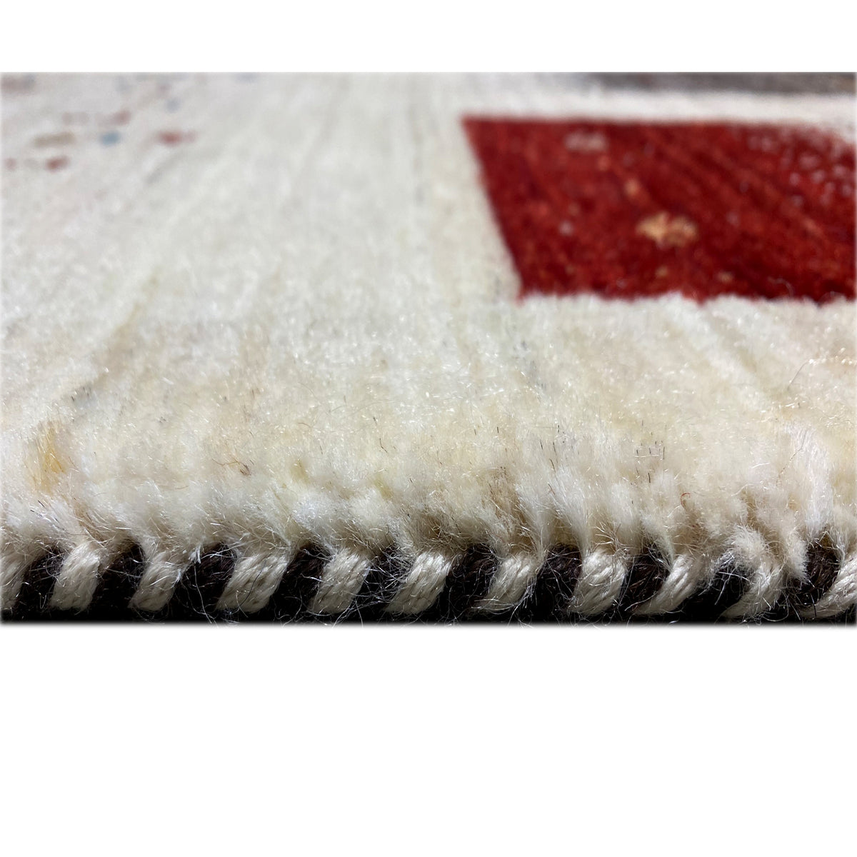 Gabbeh-Luri rug border with dense pile, twisted fringe in cream and dark gray
