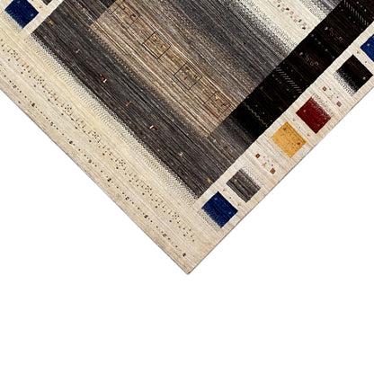Gabbeh-Luri rug detail: geometric panels in gray, beige, and colorful tile accents
