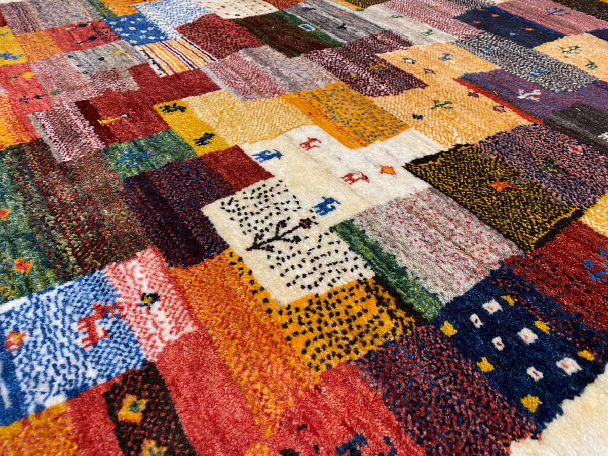 Gabbeh Luri rug 145x105 cm close-up: colorful quilt blocks and a light border edge