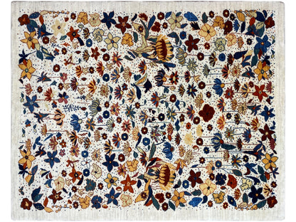 Rectangular rug with a dense multicolored floral and ornamental pattern, light-colored pile