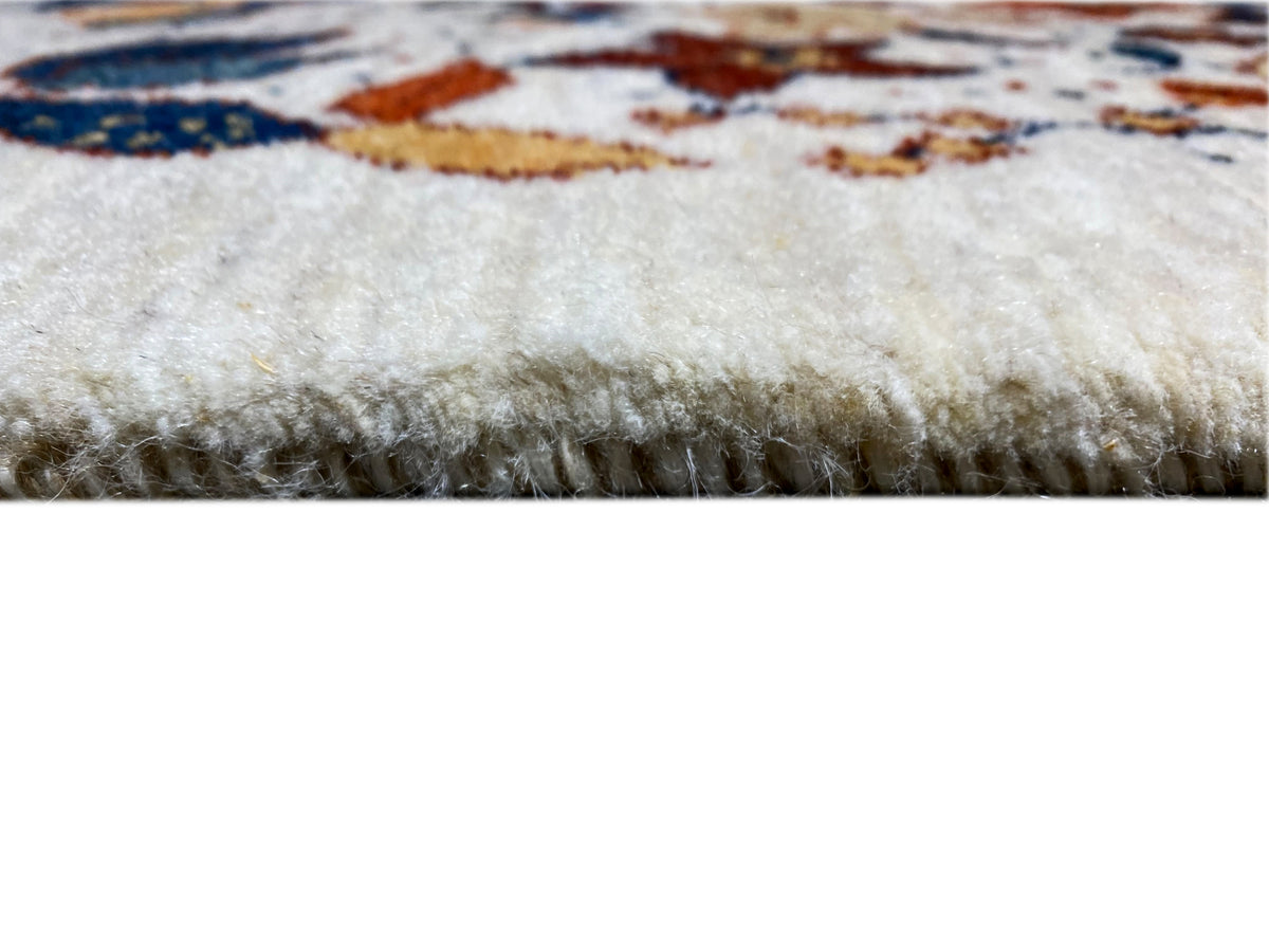 Rug edge with short pile and fringe, light underside visible