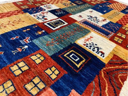Gabbeh-Luri rug 158x86 cm, detailed view: central diamonds and borders in blue and ochre