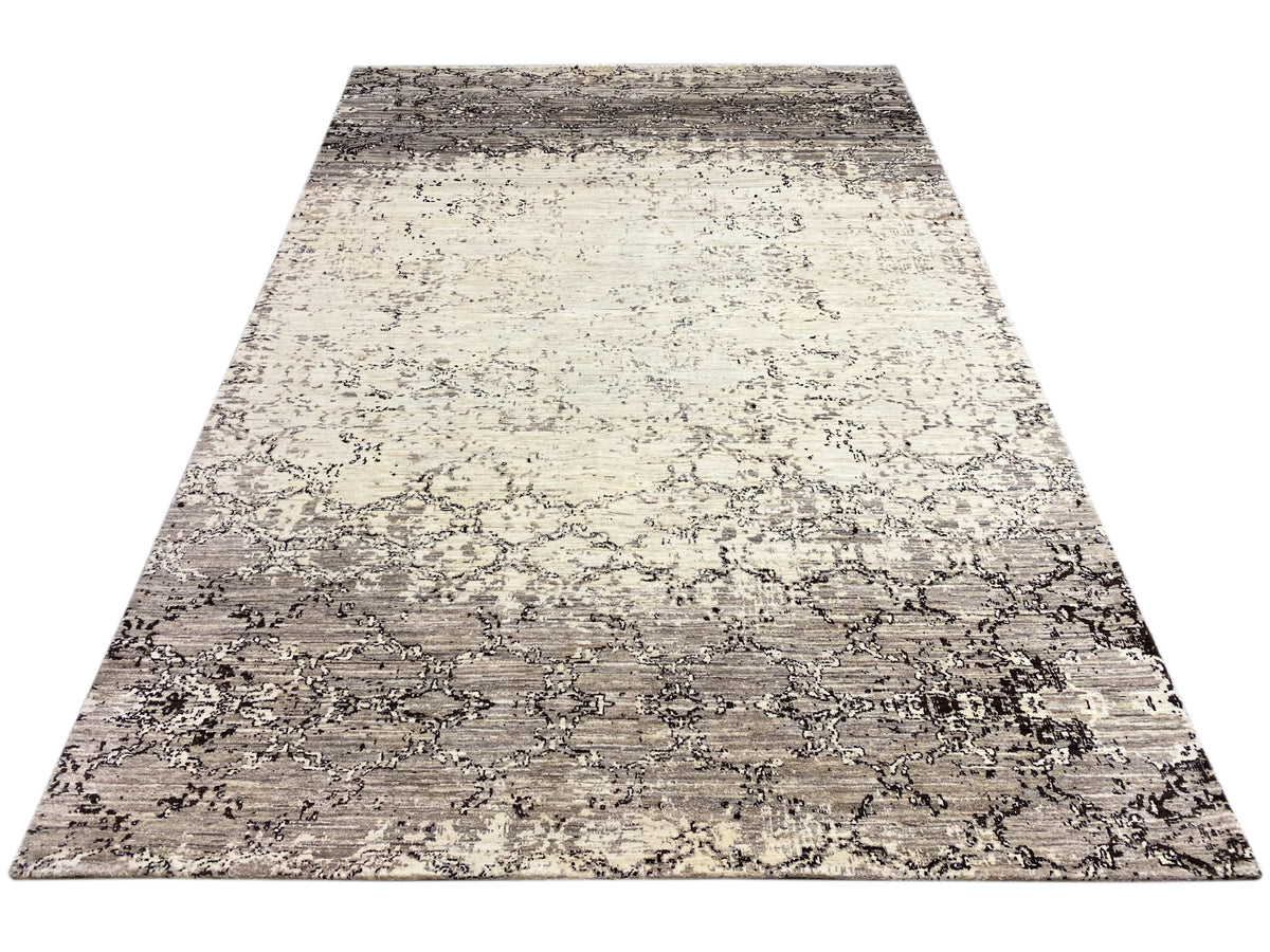 Rectangular rug with a two-tone abstract pattern in beige and gray