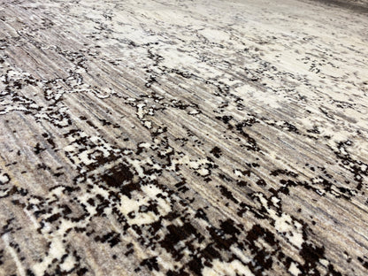 Close-up of the carpet surface with gray and black ornamental stripes on a light background