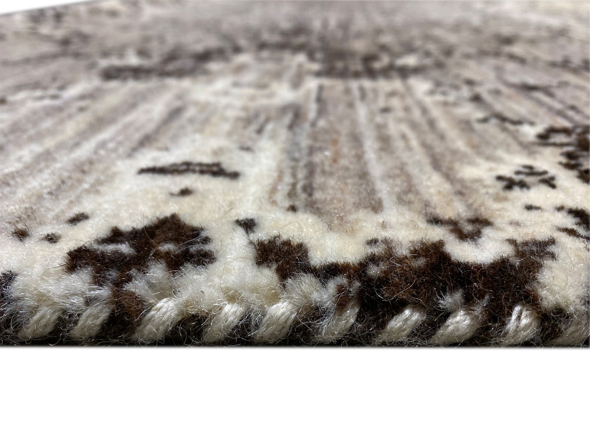 Close-up of the carpet pile: light fibers with dark gray patterns and a dense weave structure