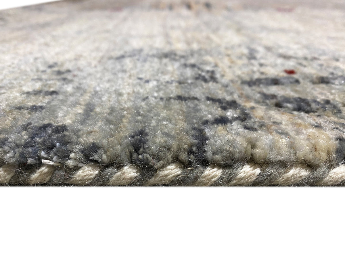 Gabbeh-Luri rug edge view: low-pile with a patterned surface and fringes
