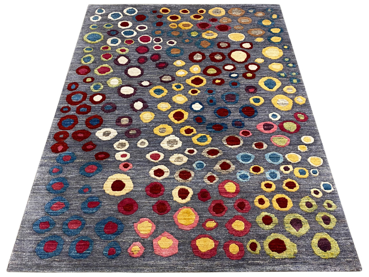 Elongated Gabbeh-Luri rug: gray surface with many colorful circular and ring patterns