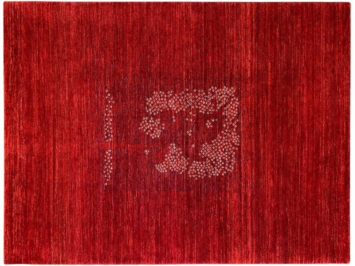 Reddish-brown rug with woven-in medallion details and a fine, even texture