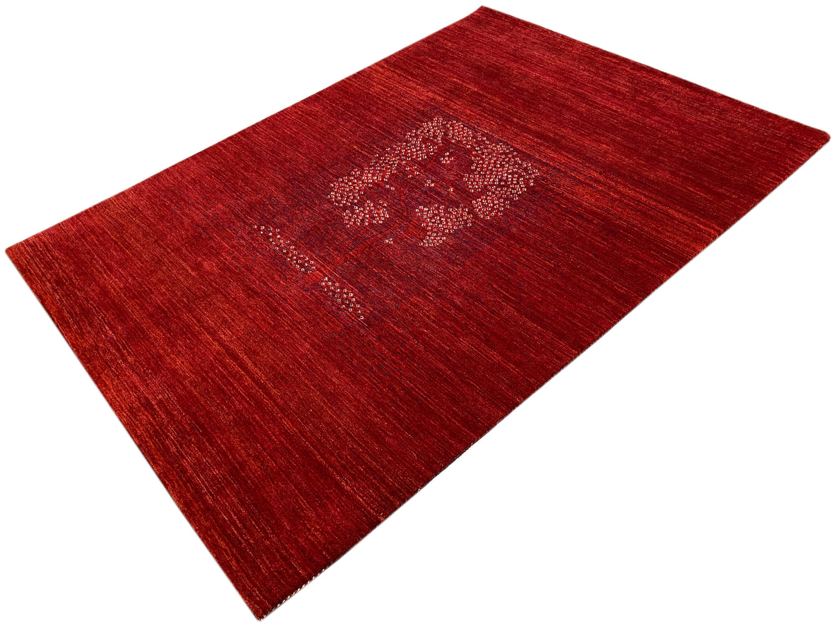 Reddish-brown rug with a central medallion and densely woven, mottled surface