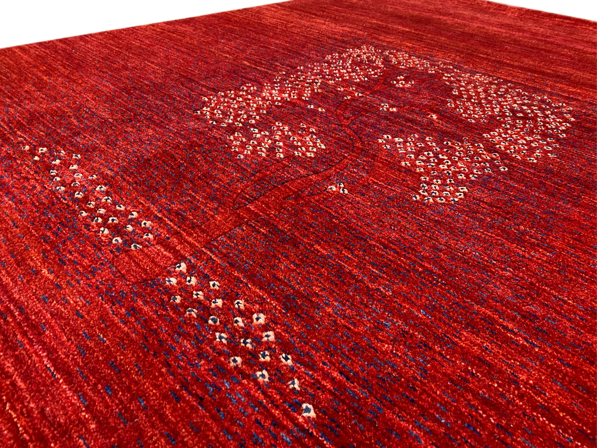 Detailed view of the medallion pattern: reddish-brown texture with glittering dots