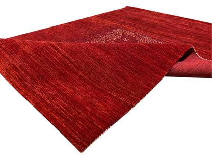 Rug with rolled edge: reddish-brown pile surface and medallion in the upper section