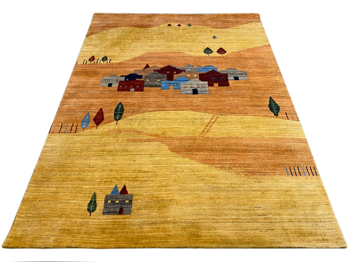 Rug with a border at the top and a central village motif in shades of blue and red
