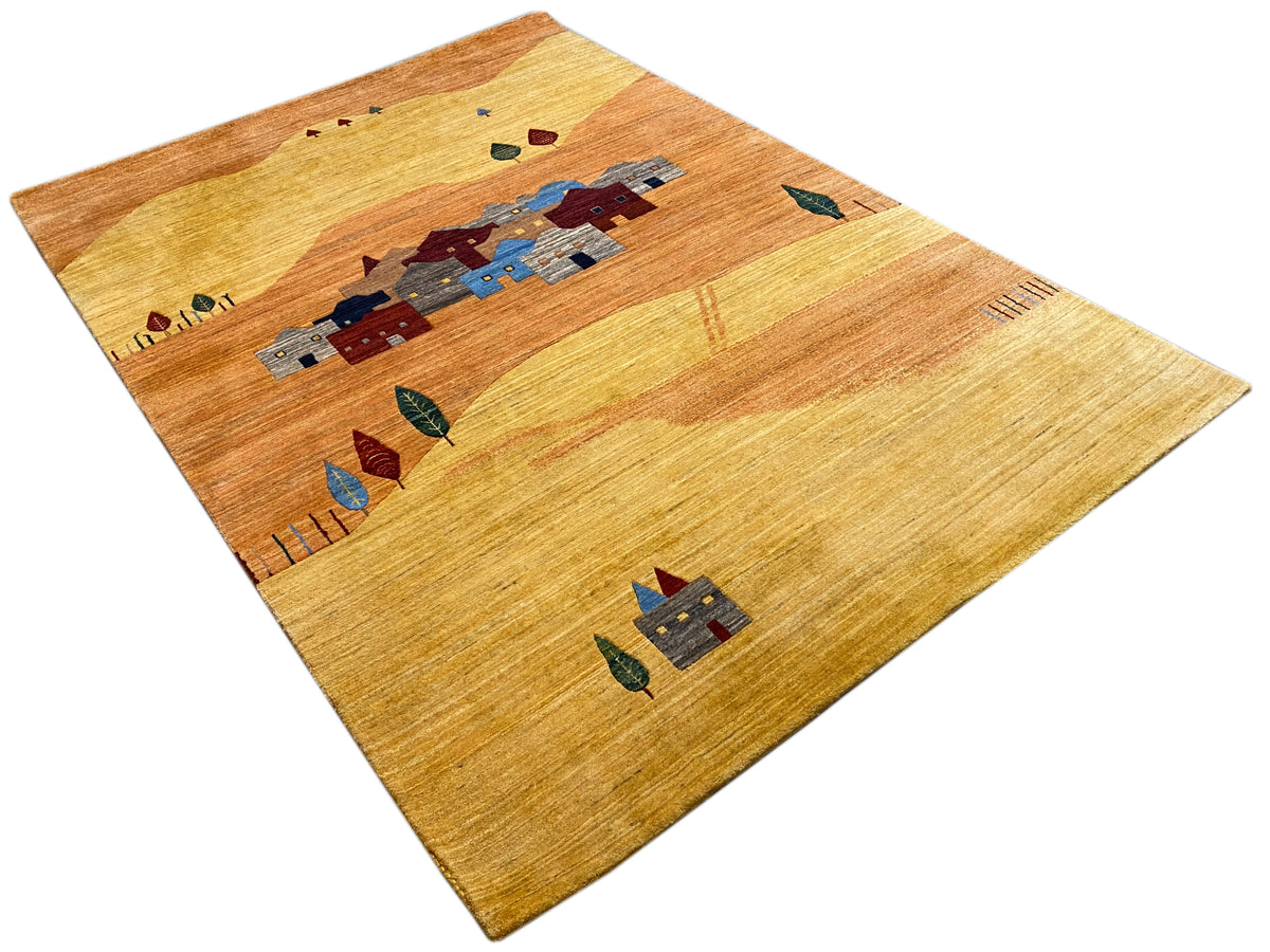 Rug with a light background and a central village motif in blue and red, with a narrow border
