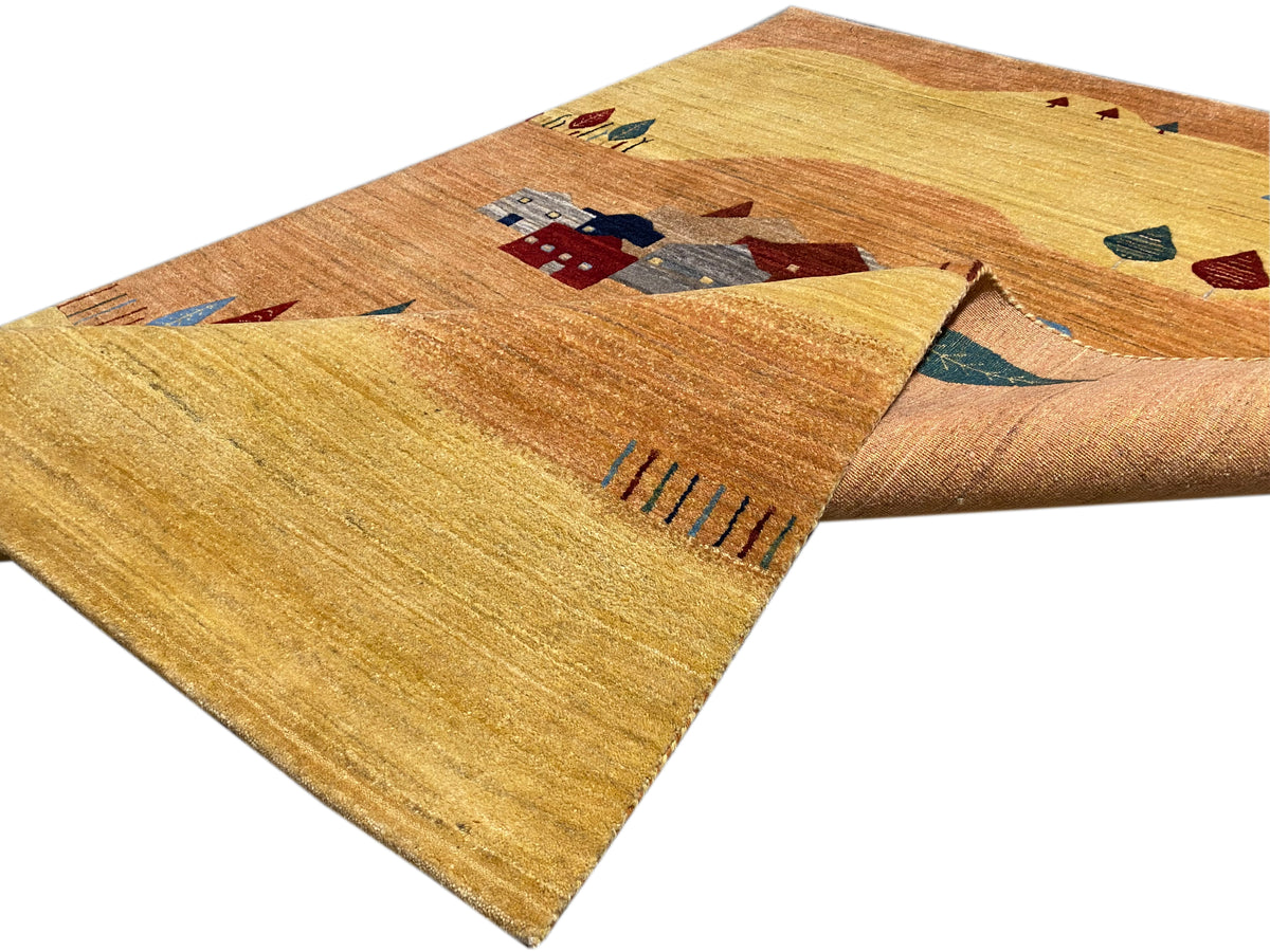 Rug with houses and abstract shapes, yellow-brown with blue and red tones