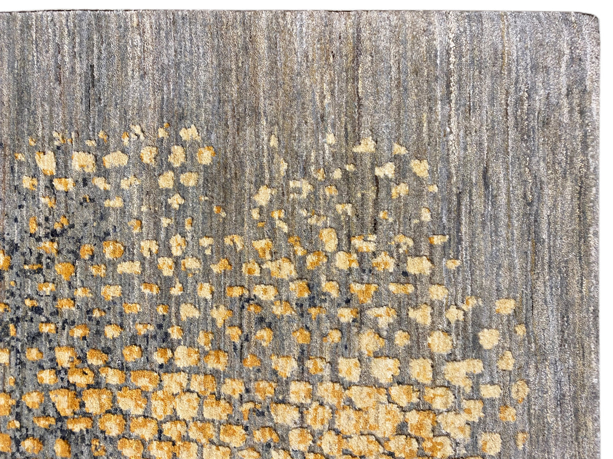 Gabbeh-Luri rug detail view: elongated gray fibers with yellow-gold flecks