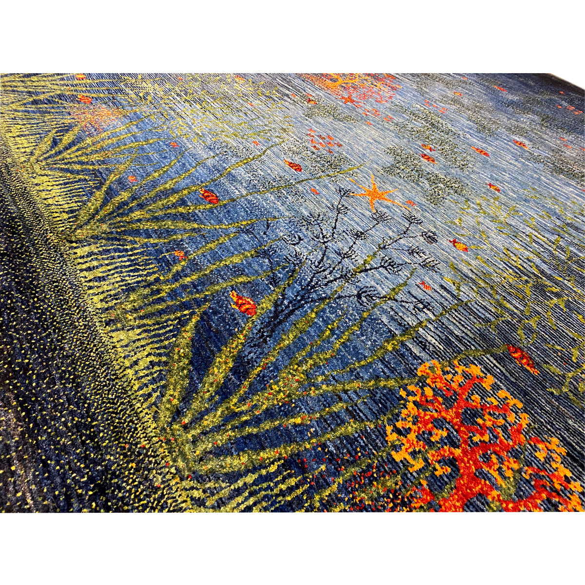 Carpet texture: dense pile in blue, yellow-green, and orange flecks