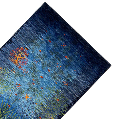 Carpet corner: blue pattern with light green branches and an orange flower cluster