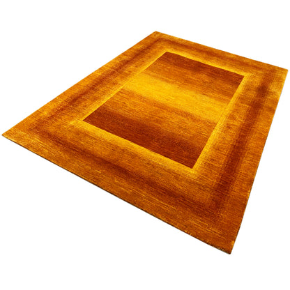 Rug with a centered square and wide border, gold and rust brown