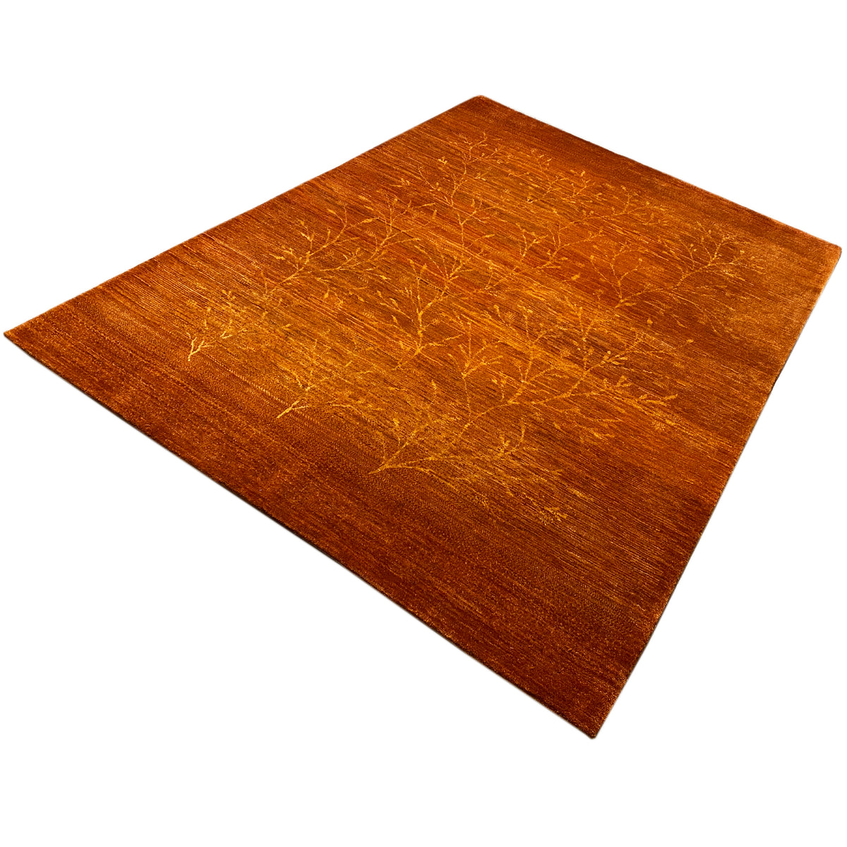 Orange rug with gold-colored ornamental lines and a rectangular shape