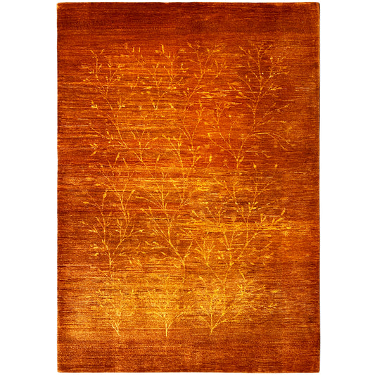 Rug with orange-brown pile and a golden tree-line pattern