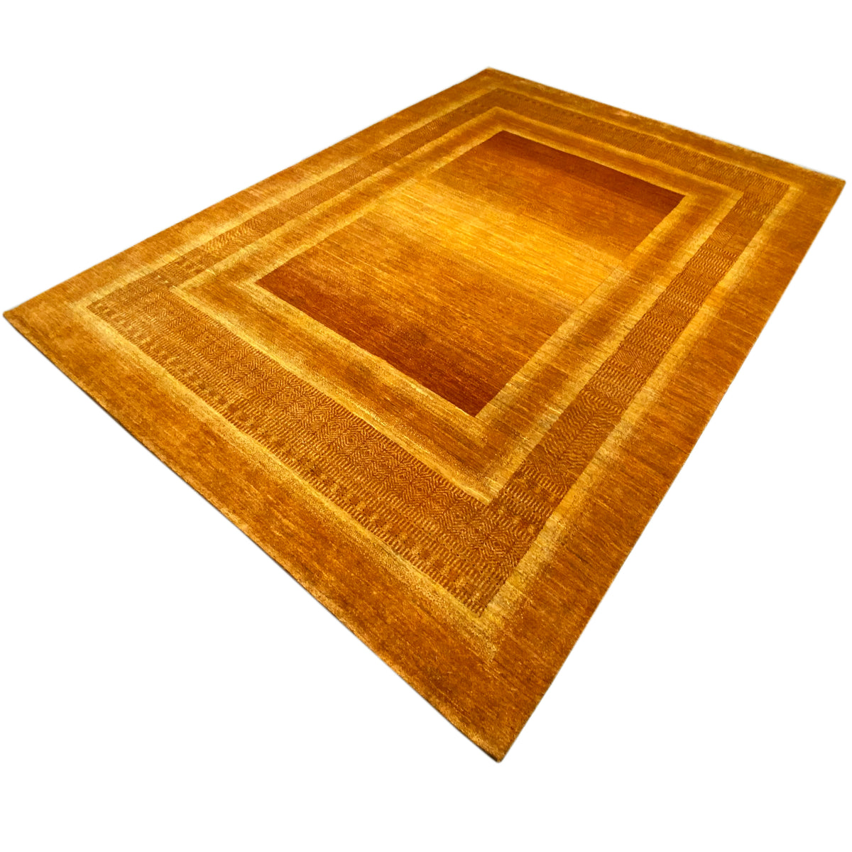 Rug with a centered border design and geometric lines in golden brown