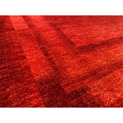 Close-up: red Gabbeh-Luri rug with a textured surface and block pattern
