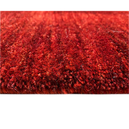 Close-up of the pile: red Gabbeh-Luri rug with a dense, glossy fiber surface