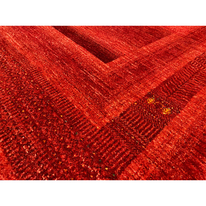 Gabbeh-Luri rug in red: Detailed view of the woven texture with shiny fibers
