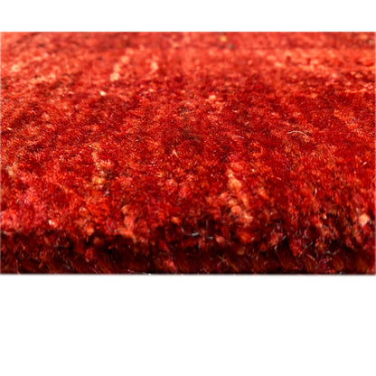Red Gabbeh-Luri rug, close-up of the pile surface with a fine, dense weave structure