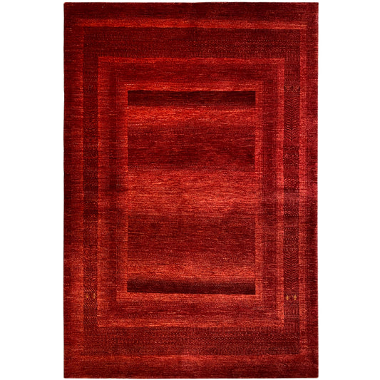 Gabbeh Luri rug with a red geometric pattern and rectangular medallion