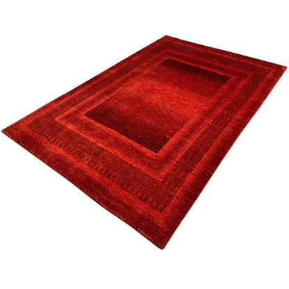 Red Gabbeh-Luri rug with a central medallion and a wide border pattern